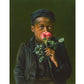 American Beauty - Young boy smelling a rose