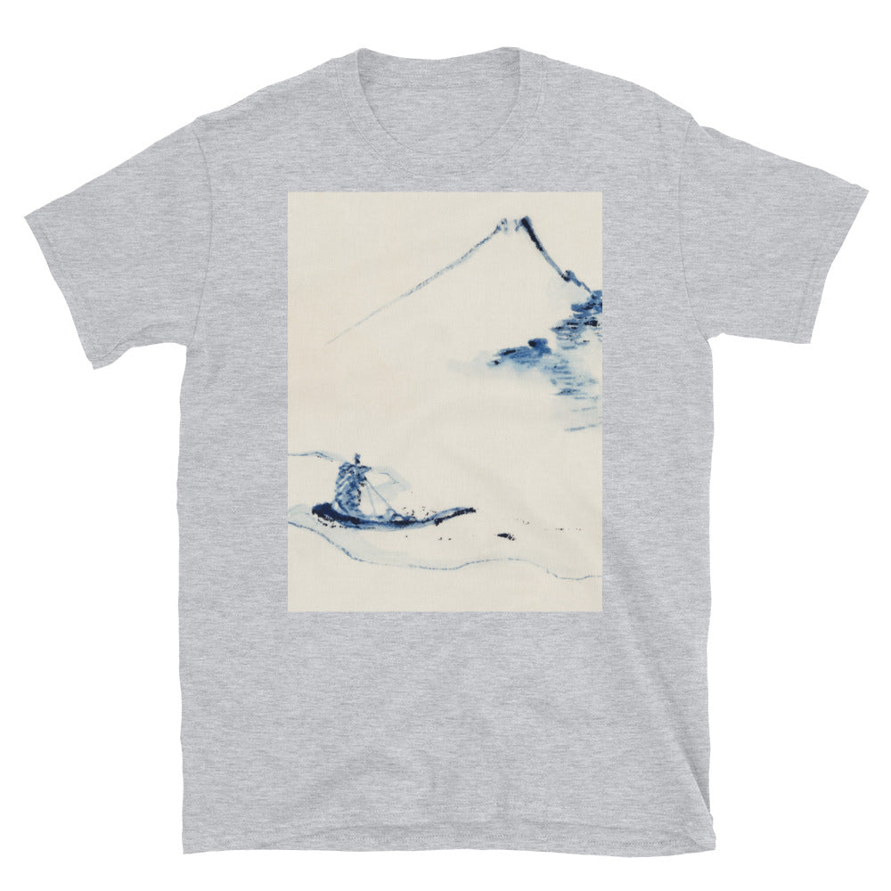 a person in a small boat on a river with mount fuji in the T-shirt